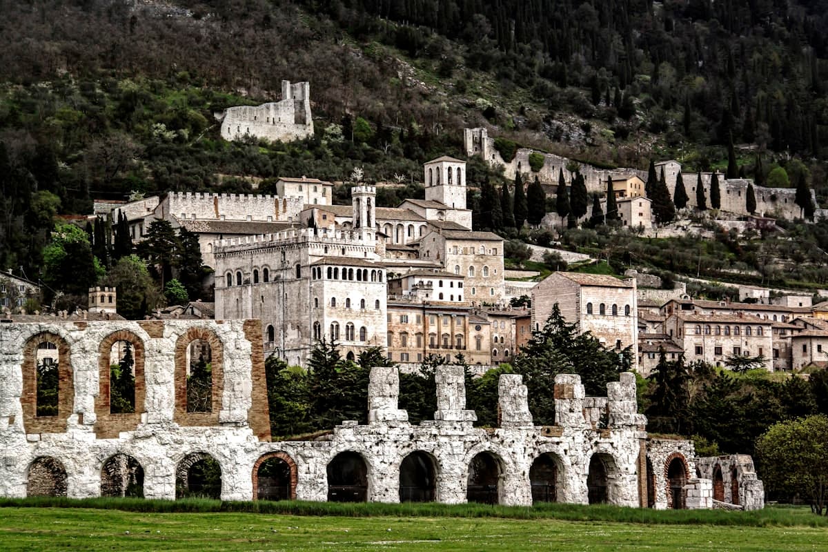Medieval Gubbio with the Roman amphitheater and Palazzo dei Consoli climbing the hillside